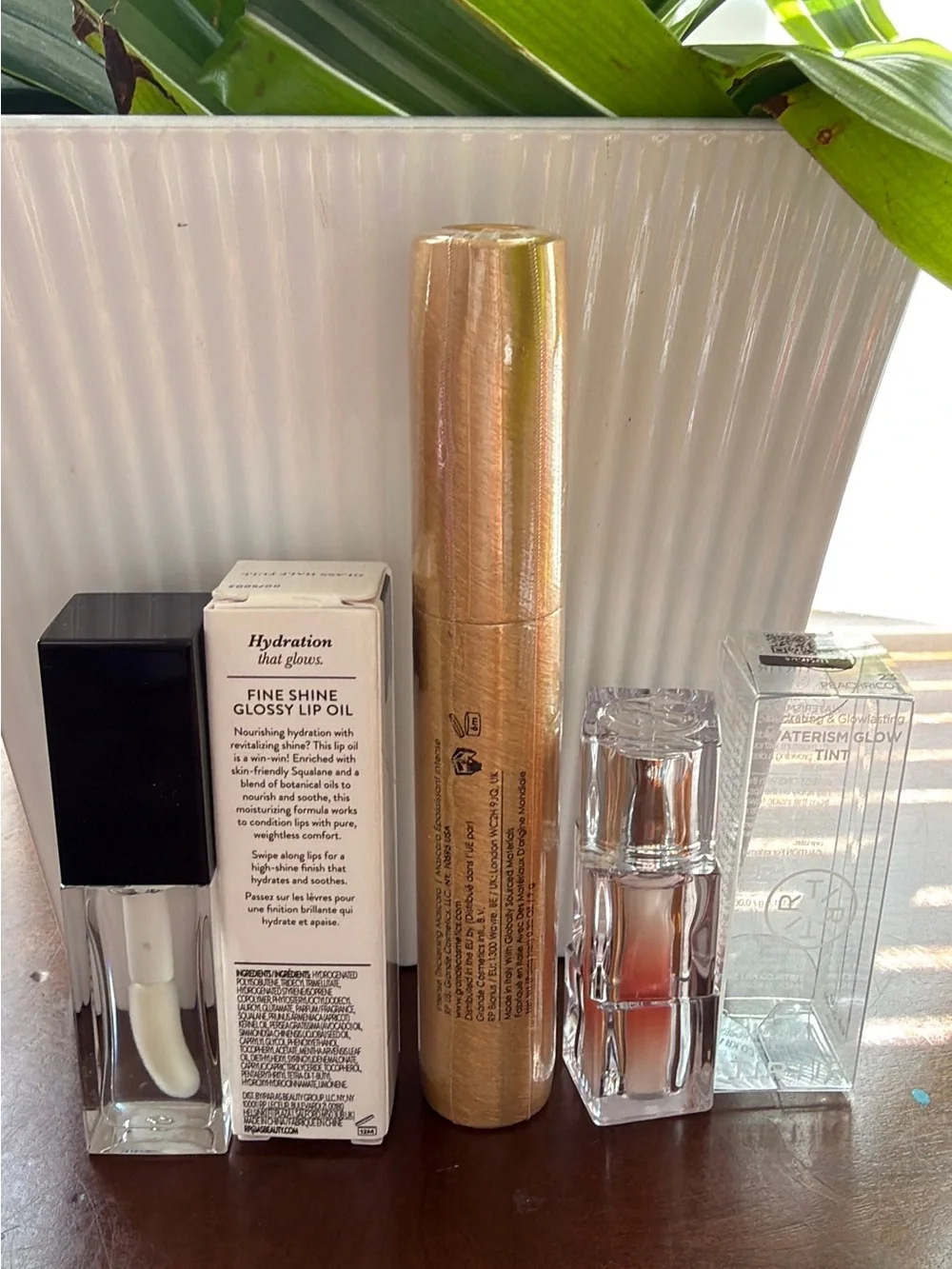Laura Geller Glossy Lip Oil + Grande Drama Mascara + Tirtir Glow
